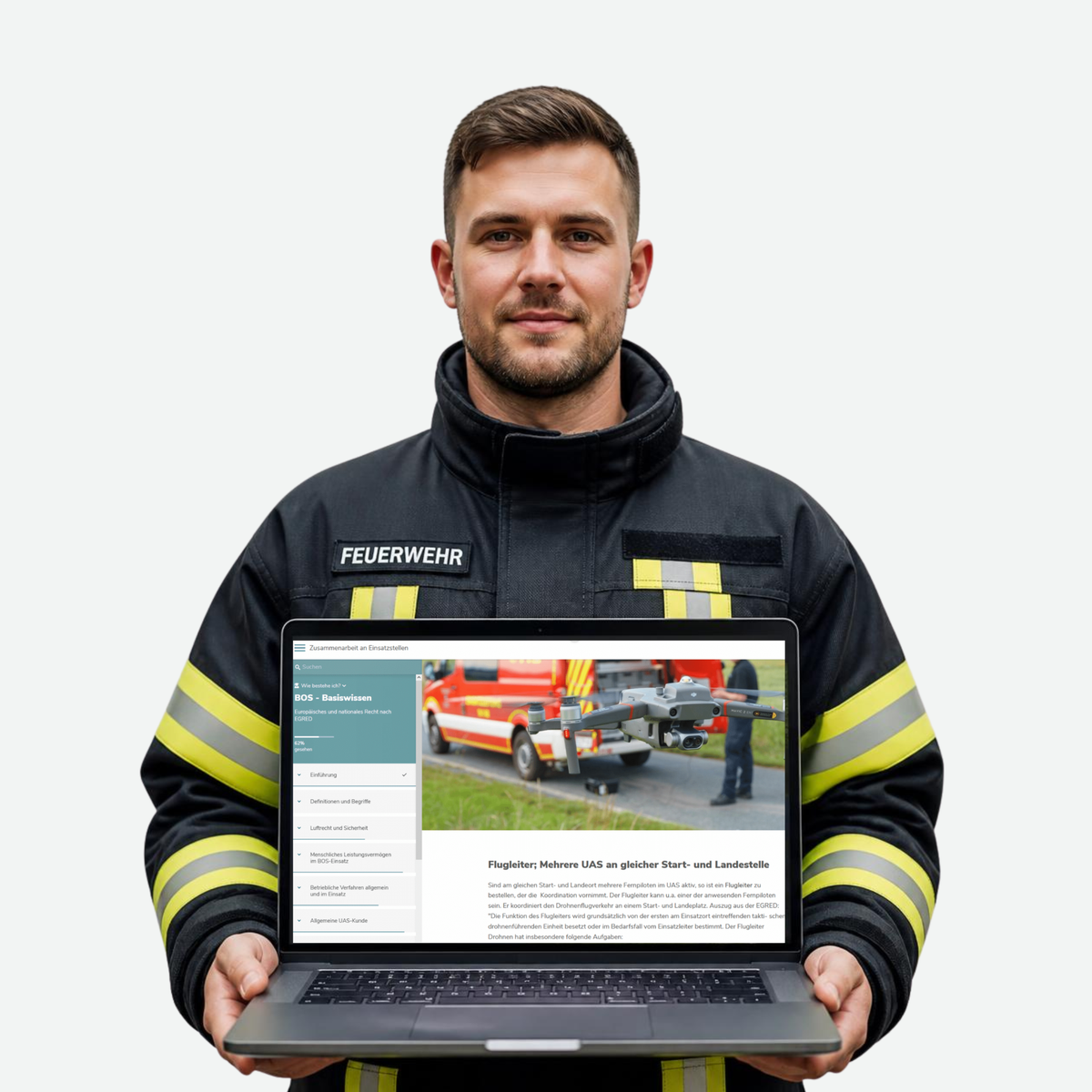 Feuerwehmann hält Laptop mit Online-Schulung: BOS-Wissen für Fernpiloten
