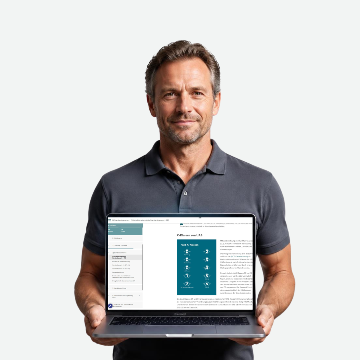 STS-Drohnenpilot hält Laptop mit STS-E-Learning in die Kamera